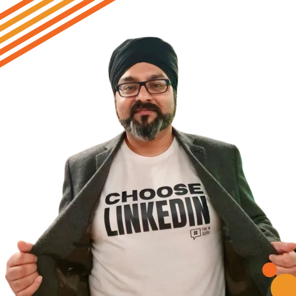 Gus Bhandal – Choose LinkedIn (1) Gus Bhandal in a suit, opening the jacket to reveal a 'Choose LinkedIn' t-shirt